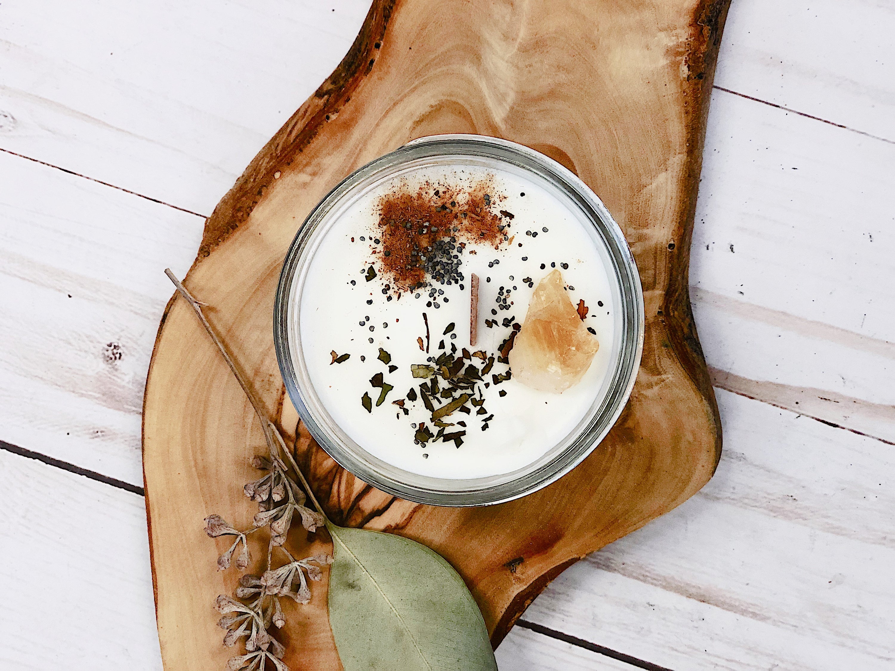 Eco-Friendly Abundance Ritual Intention Candle on an aesthetic bark backdrop