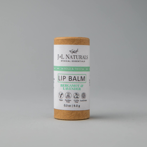 lip balm in brown and sage green packaging in white backdrop zoomed out