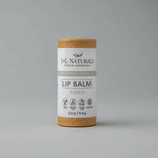 lip balm in brown and light grey packaging in white backdrop zoomed out